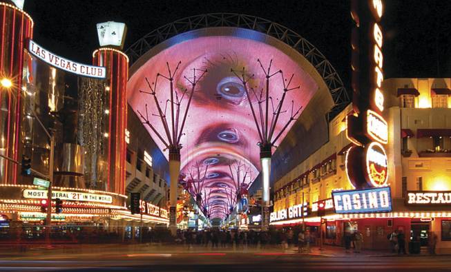 The 1,500-foot-long canopy over downtown's Fremont Street Experience that serves as a giant video screen was unveiled in 1995 and upgraded in 2004.