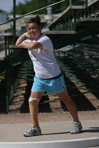 Boulder City High freshman Danyell Harding practices the shot put last week. Harding, who had her right leg amputated below the knee as an infant, wears a prosthetic limb. She competed in the shot put and discus this spring.