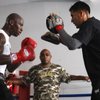 Former light heavyweight champion Antonio Tarver, left, works on his timing with assistant trainer Joe Ponce as trainer Buddy McGirt during a workout Wednesday, May 6, 2009. Tarver will fight Chad Dawson for the IBF title Saturday night at the Hard Rock.