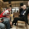 Robert Nutton waves to a friend while getting his shoes shined by UNLV football player Matt Murphy during Joy Prom on Friday at M Resort.