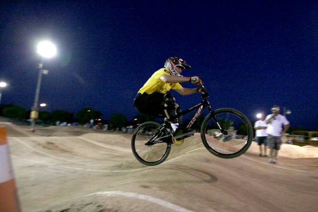 Metro Officer Michael Kaczmerk rides with Boulder City youth during BMX Is Not A Crime 