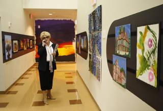 Meadows School president Carolyn Goodman takes a phone call in a hallway filled with student artwork at the school in Summerlin Monday, May 11, 2008. The private school is celebrating its 25th anniversary. 