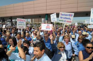 Hundreds of Las Vegas hospitality workers rallied Tuesday to recognize National Tourism Week at the Las Vegas Convention Center.