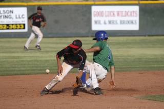 Green Valley High's Erick Fedde, right, slides in safely at second base against Las Vegas High Friday during the Sunrise Regional Championship game.  Green Valley defeated Las Vegas 15-5.