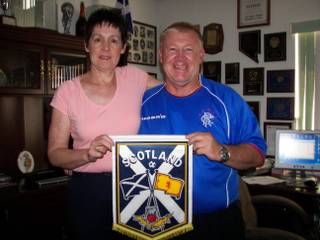 Longtime Las Vegas soccer official John Kennedy and wife Marjory display a flag of Scotland, their homeland, in their Henderson home.