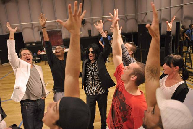 Kenny Ortega and Michael Jackson with the 12 dancers selected for Michael's upcoming This Is It concert run at London's O2 Arena. The dancers were chosen from 5,000 applicants.