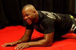 UFC light heavyweight champ Rashad Evans goofs around with media members during a workout Wednesday at the MGM Grand Garden Arena. Evans takes on undefeated Lyoto Machida at UFC 98 Saturday night.