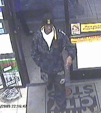 A surveillance video image of the man sought in a robbery and kidnapping. 