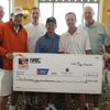 UNLV coach Lon Kruger and friends pose with a donation to the American Cancer Society at last year's Coaches vs. Cancer event in Las Vegas.