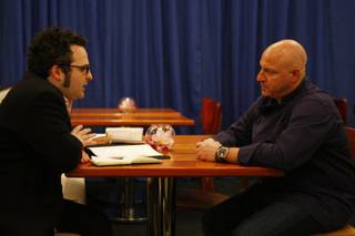 Eli talks strategy with Tom Colicchio before service starts during Restaurant Wars.