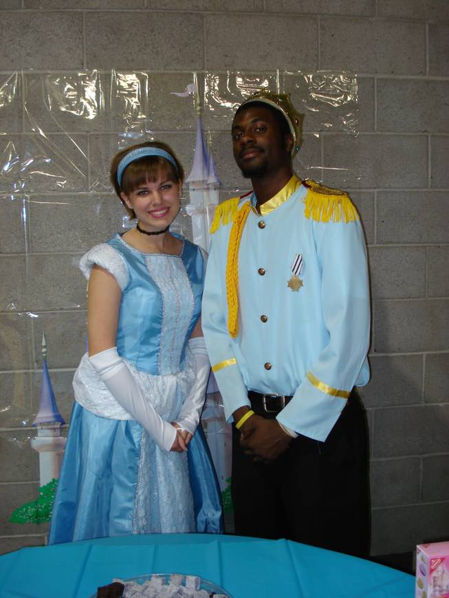 A couple portray Cinderella and Prince Charming at the Prince and Princess Ball for All.