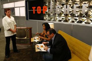 Robin serves Padma Lakshmi and guest judge Paul Bartolotta a TV dinner during the Quickfire challenge on "Top Chef: Las Vegas".