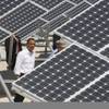 President Barack Obama looks at solar panels at Nellis Air Force Base in Nevada in 2009. The Air Force announced recently that it has signed a lease to build a second solar facility at Nellis, this time a 19-megawatt plant.