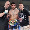 Alex Ruiz, center, celebrates with Filipino MMA team members Bill Garness and Erik Cruz after his 155-pound title victory over Christian Palencia at the Tuff-N-Uff show on April 24, 2009 at the Orleans.
