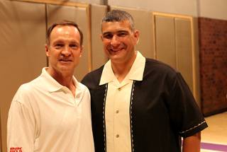 UNLV head coach Lon Kruger poses with Kansas State head coach Frank Martin on Sunday night at the Hardwood Suite at the Palms in Las Vegas. 
