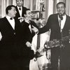 Sam Butera, right, performs with Louis Prima, left, Rolondo "Rolly-Dee" Diloria (bass) and Jimmy Vincent (drums). This photo, according to the Louis Prima Archives, is from the mid 1960s in Las Vegas.  They often performed in the Casbah Lounge in the Sahara Hotel and Casino. 
