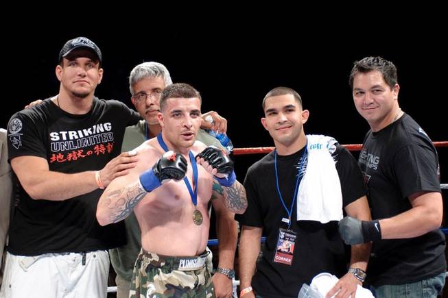 Larry Mir, center, the cousin of UFC interim heavyweight champ Frank Mir, scored a successful MMA debut Saturday night at the Orleans arena when he defeated Samual  Varrin by split decision.