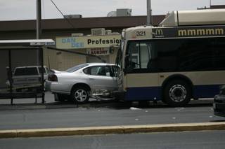 A passenger leaving a Citizens Area Transit bus on Boulder Highway at Lamb Boulevard was struck by debris after a motorist hit a light pole.
