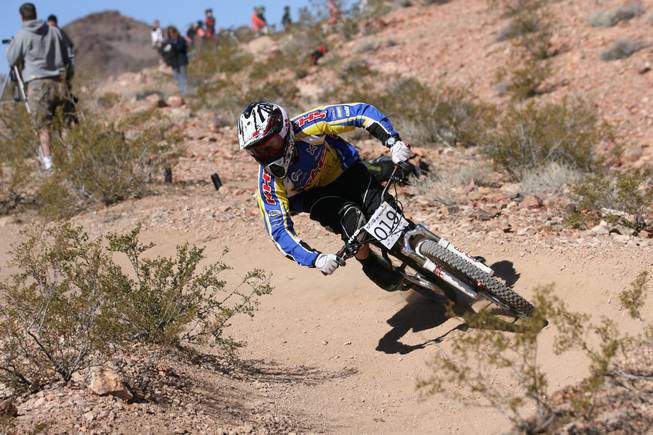 A bicyclist hits the trails at Bootleg Canyon in Boulder City during a competition.