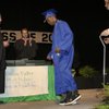 LaQuan Phillips walks across the stage on his own to receive his diploma from Southeast Region Assis