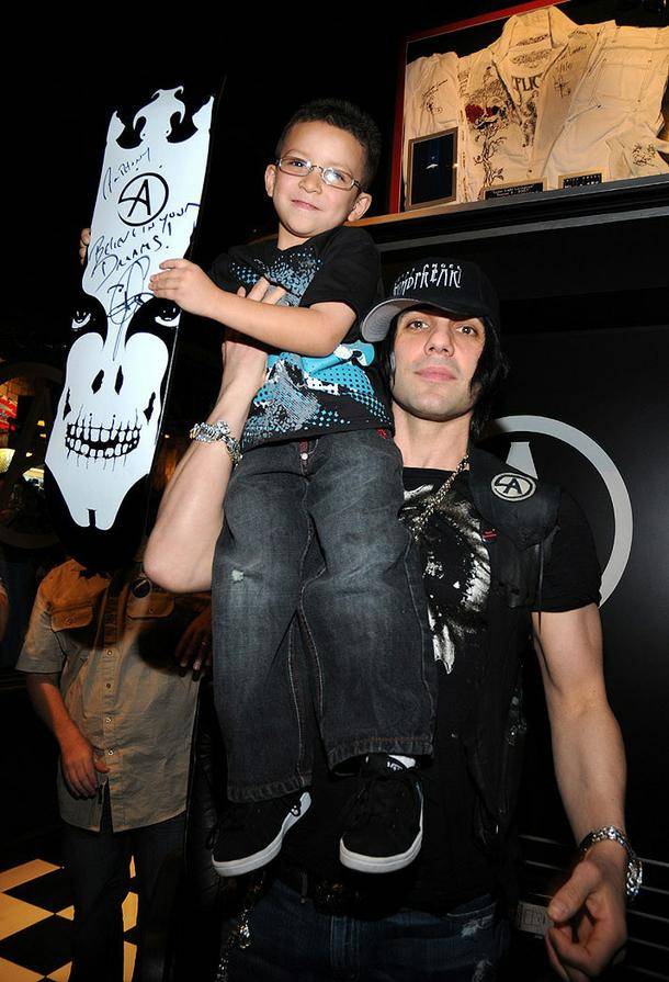 Criss Angel, with a happy young fan, opens his third Las Vegas store, Mindfreak, in Circus Circus. The two other stores are located inside the Luxor.