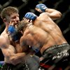 Mike Brown, left, punches Urijah Faber in the fifth round of a World Extreme Cagefighting featherwei