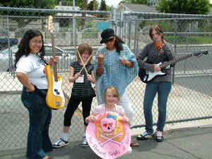 "The Flaming Skulls of Death," an all-girl band at Girls Rock Vegas, are Candace Chun (an instructor at the camp), Jessie Lea, Ashley Lybarger, Tahirra Jackson and Nona Fuller. The  Las Vegas summer camp provides young girls with rock music instruction, promotes self expression and provides support.
