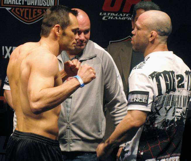 Rich Franklin, left, and Wanderlei Silva face-off during the weigh-in on Friday June 12, 2009 for Saturday's UFC 99, in Cologne, Germany.