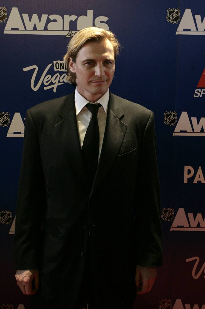 Sergei Fedorov stops for photographs on the red carpet outside the Palms Thursday prior to the NHL Awards show.