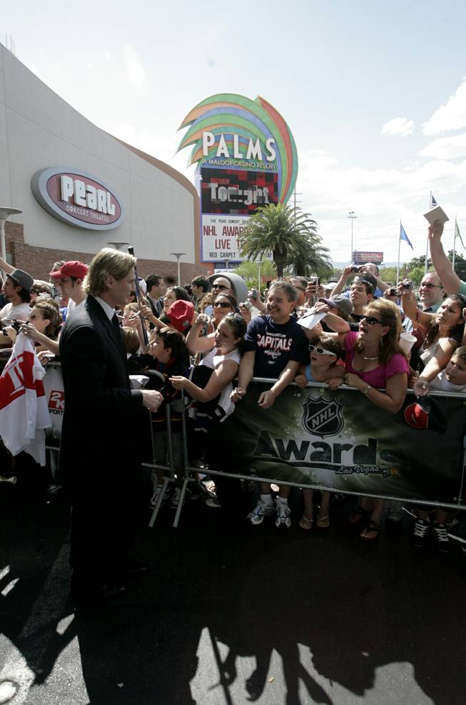 Sergei Fedorov signs autographs on the red carpet outside the Palms Thursday prior to the NHL Awards show.