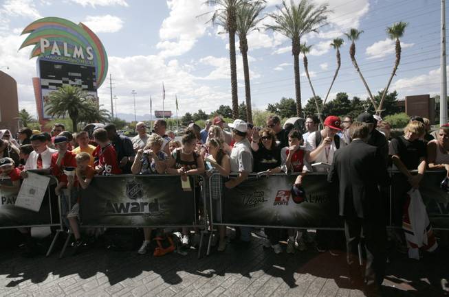 Producer Jerry Bruckheimer signs autographs on the red carpet outside the Palms Thursday prior to the NHL Awards show.