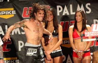 Clay Guida prepares to hop on the scale as The Ultimate Fighter weigh-in was held at The Palms Friday.  The TUF 9 finale will be held Saturday inside the Pearl at The Palms with Guida taking on Diego Sanchez in the main event.

