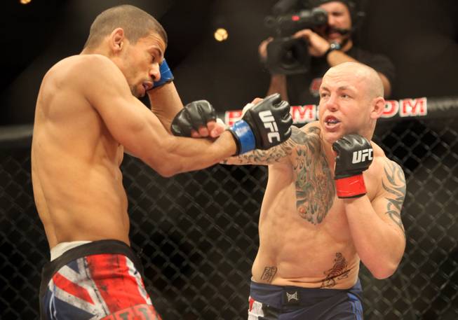Britain's Ross Pearson, right, punches fellow Team U.K. fighter Andre Winner during the lightweight finals bout of "The Ultimate Fighter" Saturday night at the Palms. Pearson won by unanimous decision to earn the UFC's guaranteed six-figure contract.
