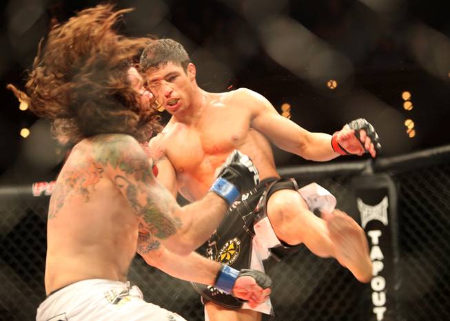 Diego Sanchez, right, lands a big shot to Clay Guida during their main event bout at The Ultimate Fighter on Saturday, June 20, 2009. Sanchez won by split decision.