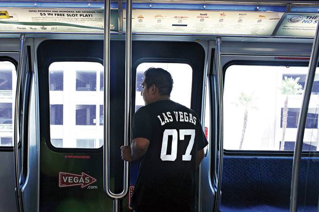 
A passenger takes a trip on the Las Vegas Monorail on Monday. Ridership has failed to reach the optimistic projections made before the project was approved in 2000. Ticket sales cover the operation and maintenance of the monorail, but not the repayment of construction costs.