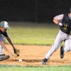Boulder City baserunner Aubrey Wrightsman, right, peels back toward first base as Green Valley second baseman Alex Bless bobbles the ball during a Legion baseball game earlier this month.
