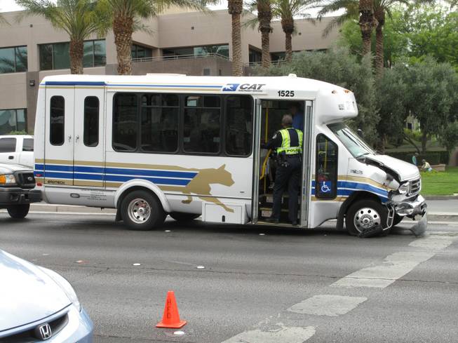 Henderson Police investigate inside a Citizens Area Transit special services van that was damaged in an accident.