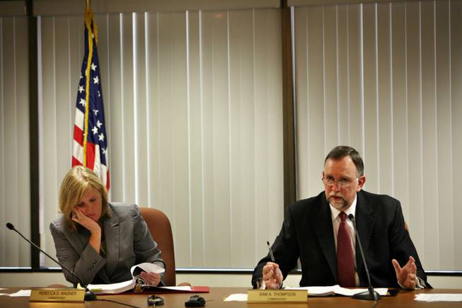 Sam Thompson, a member of the state Public Utilities Commission, makes a point during a meeting on June 24 as commissioner Rebecca Wagner listens. In explaining a NV Energy rate hike order, Thompson later said staggering the increases and factoring in lower natural gas prices would minimize the effect of the hike on ratepayers.