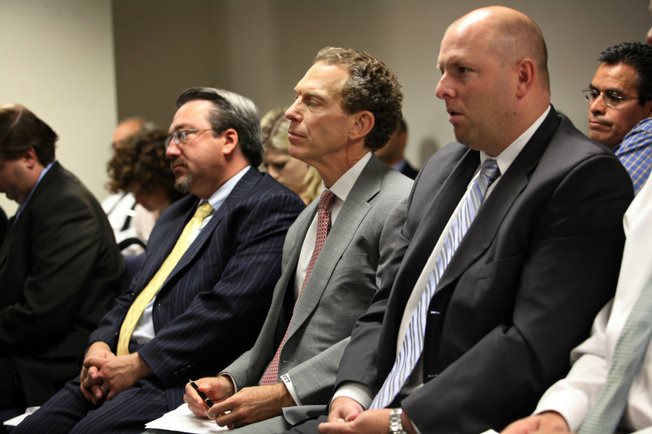 "The financial health of the company is good," said Michael Yackira, center, president and CEO of NV Energy, after a less-than-desired rate hike was approved.