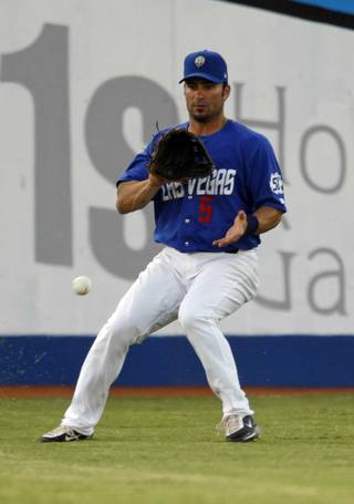 Las Vegas 51s outfielder David Dellucci fields a ground ball during a game against the Sacramento River Cats at Cashman Field Monday, June 29, 2009. Dellucci, who recently signed a minor league contract with the Toronto Blue Jays, the 51s' parent club. Dellucci was part of the Arizona Diamondbacks World Series champion team in 2001 and a proven big league player. 