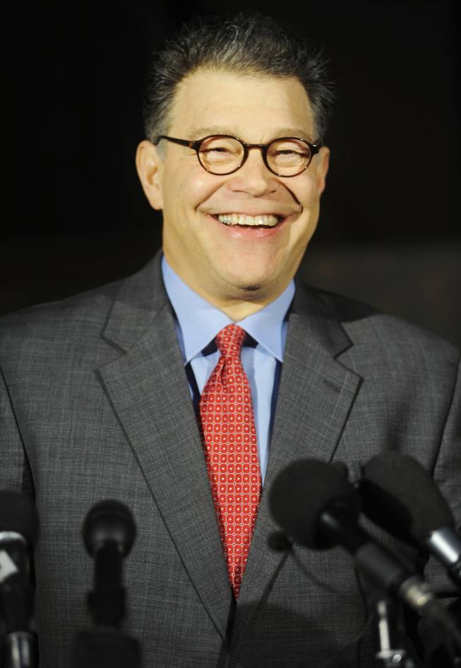 In this April 13, 2009 file photo, Al Franken talks with reporters outside his home in Minneapolis.  On Tuesday, June 30, 2009, the Minnesota Supreme Court paved the way for Franken to fill a long-vacant Senate seat. 