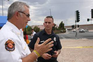 Clark County Fire Department public information officer Scott Allison discusses fireworks safety with fire inspector Dan Bushkin Tuesday.