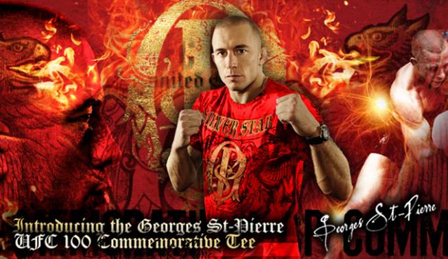 UFC welterweight champion Georges St. Pierre poses with his special Commemorative UFC 100 T-shirt.