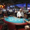 John Wang, center, deals blackjack to Jon Edwards, left, of Corona, Calif., and Michael Perk of San Diego at Buffalo Bill's in Primm.