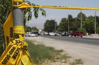 Crime scene tape blocks residents from entering their neighborhood while Metro Police investigate after an officer-involved shooting July 1 in the 5500 block of Alexander Drive, near Helen Street and Rancho Drive.