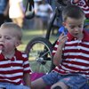 Jack Goodman, 4, cools himself off with a fan while his 2-year-old brother eats a popsicle during th