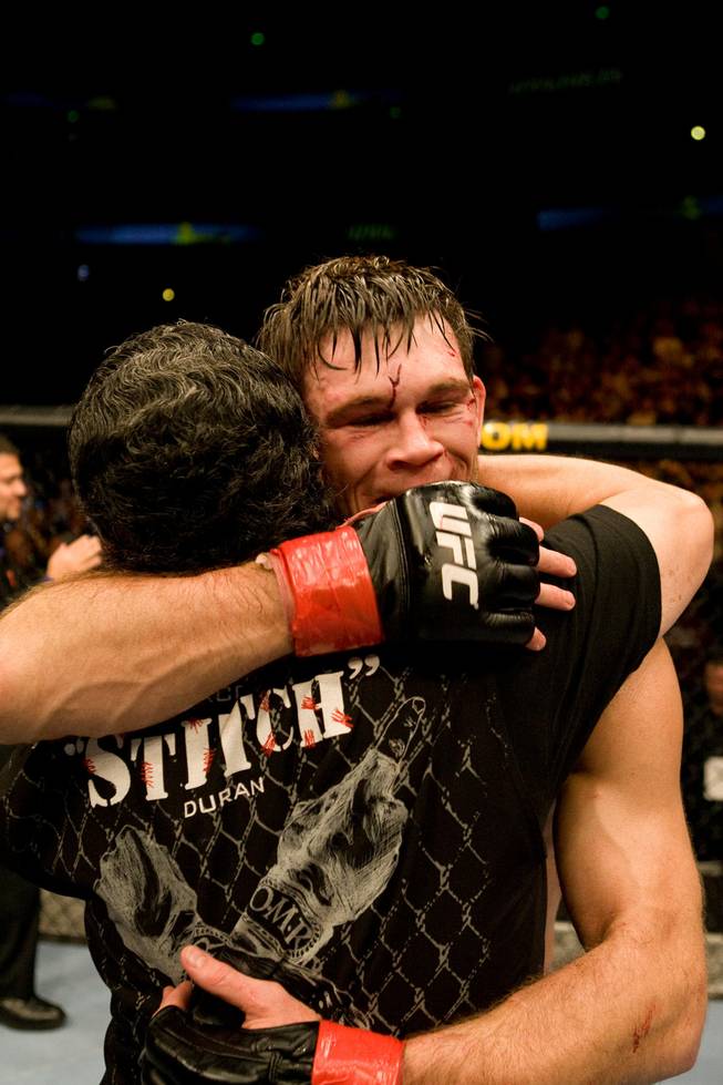 Former UFC light heavyweight champ Forrest Griffin hugs cutman Jacob "Stitch" Duran. Duran says the best part of his job is developing special bonds with fighters after performing one of his successful 60-second surgeries between rounds.