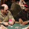 Actor Jason Alexander and rapper Nelly chat during the first day of the main event hold 'em tournament at the World Series of Poker in The Rio in July 2009.