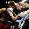Fujin Raika, left, of Tokyo battles with WBA/GBU lightweight champion Layla McCarter of Las Vegas during a 10-round fight at the South Point Friday, July 3, 2009. McCarter defended her titles with a unanimous decision win.