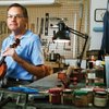 Violin maker Kevin Cardiff, shown in is home workshop, first took an instrument apart, secretly, whe